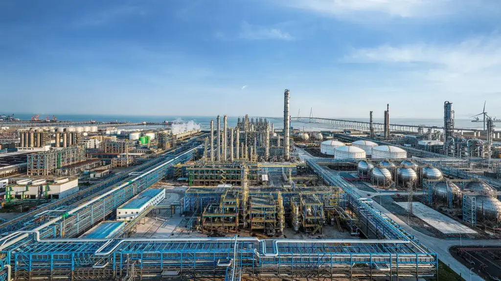 Industrial plant operator reviewing the 2026 lubricant price hike announcements on a tablet in a refinery.