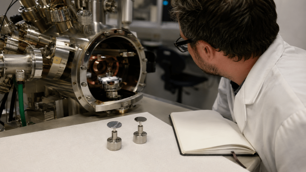 C60 XPS: How to Interpret C 1s Spectra and Fullerene Surface Chemistry 13 XPS analyst comparing C60 sample mounts during repeated exposure checks
