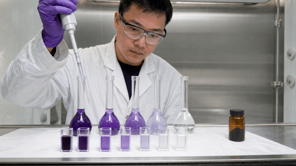 C60 UV–Vis Spectroscopy: How to Measure and Interpret Absorption Spectra 10 Chemist preparing a controlled C60 dilution series for UV-visible analysis